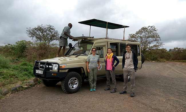 Guests beside a safari vehicle in a photograph supplied by Peacemakers
